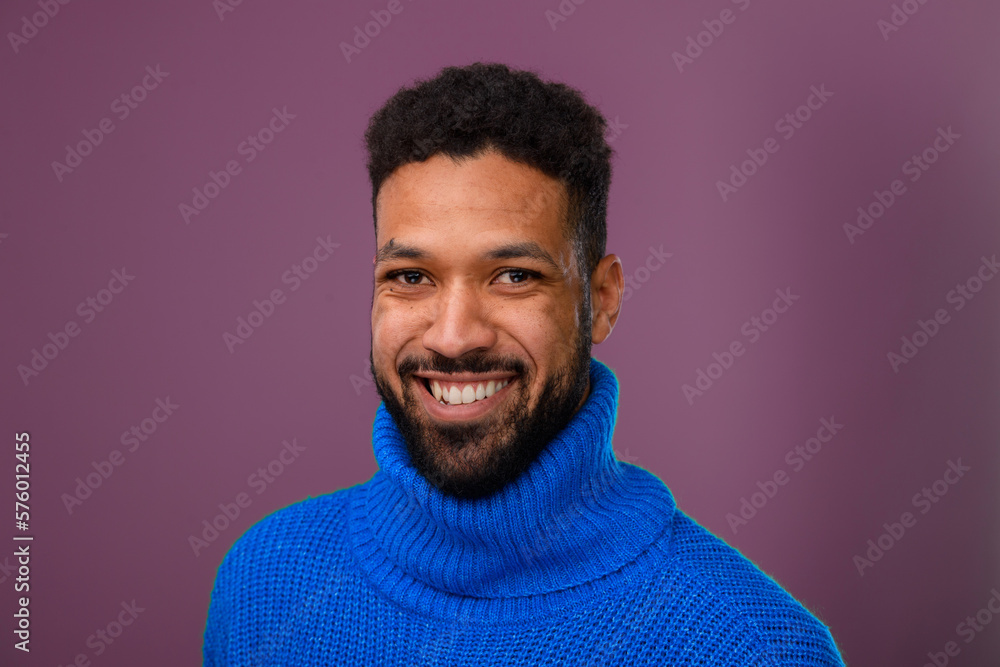 Obraz premium Portrait of happy multiracial man in knitted sweater.