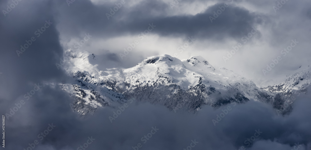 Snow and Cloud covered Canadian Nature Mountain Landscape Background. Winter Season in Whistler, British Columbia, Canada.
