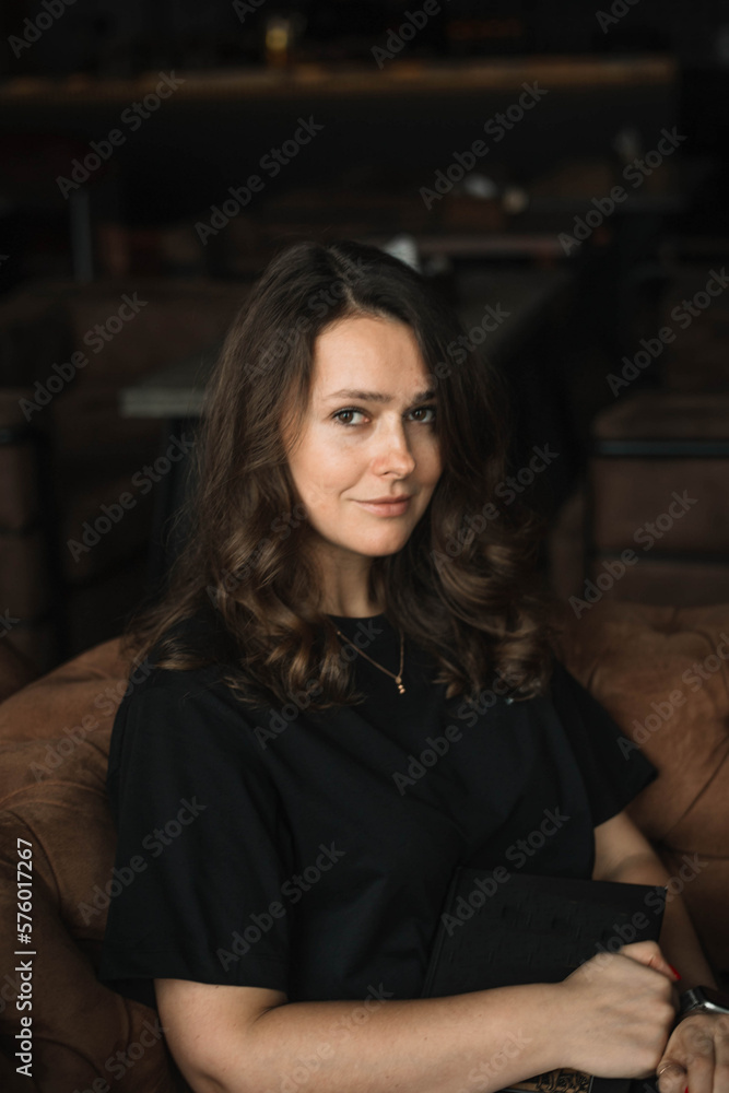 young woman with a book in a cafe, the concept of learning and self-education in psychology young woman with a book in a cafe, the concept of learning and self-education in psychology