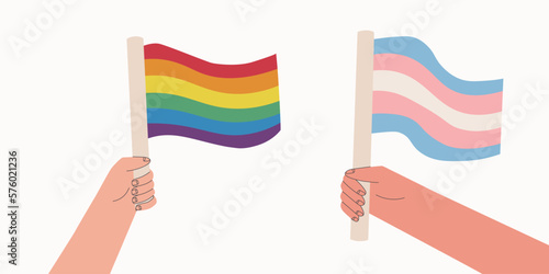 LGBT and transgender flags. Two hands holding flags are symbols of the LGBT+ community. Rainbow flag for pride month.Vector cartoon illustration.