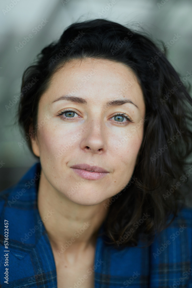 Portrait of a business woman smiling and happy. Dark blue jacket, confident woman looking in the camera High quality photo Portrait of a business woman smiling and happy. Dark blue jacket, confident woman looking in the camera High quality photo