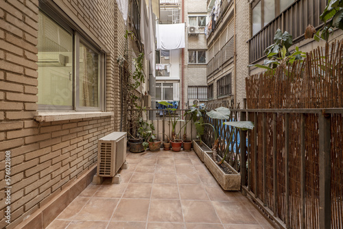 Terrace of a house on the ground floor in the inner courtyard of an urban residential building