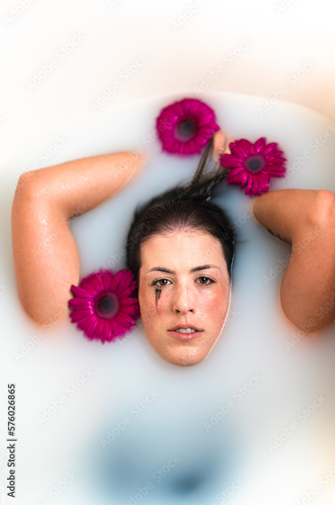 Sensual woman taking bath with flowers and milk Stock Photo Adobe Stock