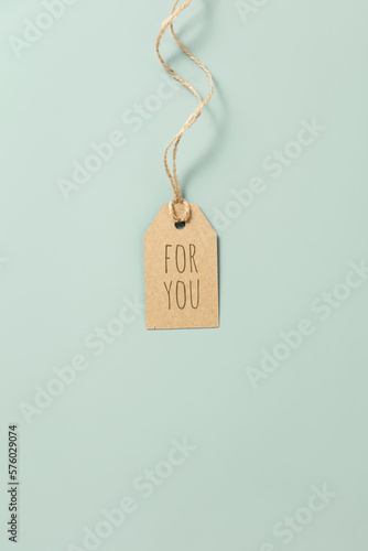 gift tag with text on pastel blue background