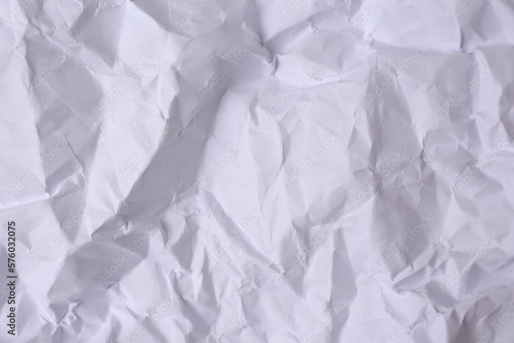 Sheet of crumpled paper white as background, top view Sheet of crumpled paper white as background, top view