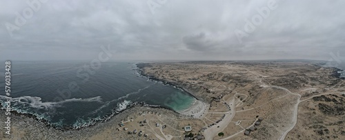 Playa la Virgen, Atacama/Chile- February, 02, 2023: White sand beach, turquoise water and surrounded by the Atacameño desert.