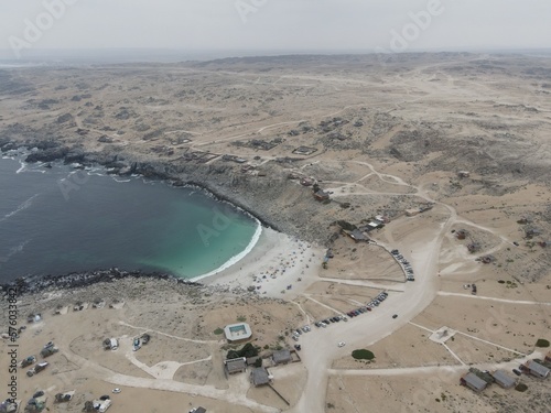 Playa la Virgen, Atacama/Chile- February, 02, 2023: White sand beach, turquoise water and surrounded by the Atacameño desert.