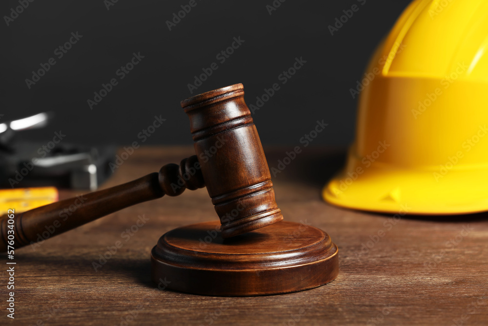 Construction and land law concepts. Gavel on wooden table, closeup Construction and land law concepts. Gavel on wooden table, closeup
