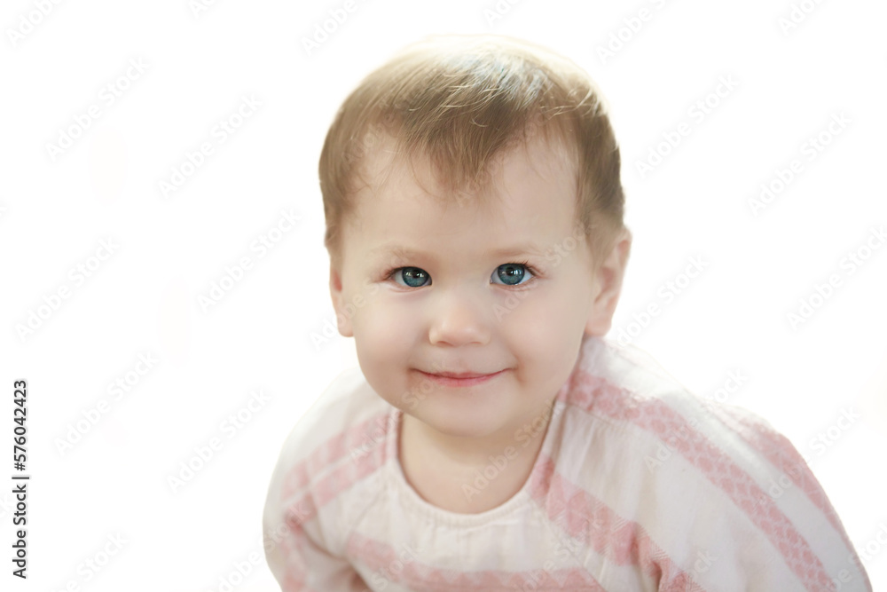 Beautiful little girl isolated on white background. Beautiful little girl smiles happily. Lovely baby close up.
