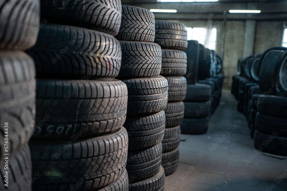 stack of car wheel tires at modern warehouse stack of car wheel tires at modern warehouse