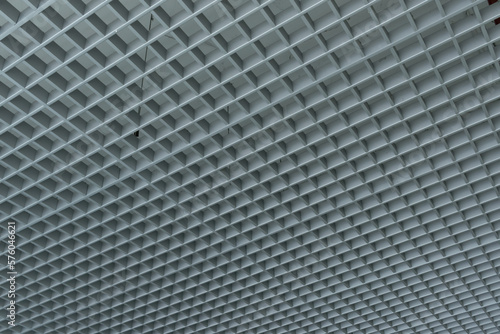 grid ceiling background is beautiful because it is designed to cover traces of original ceiling resulting in modern grid ceiling pattern. backdrop of ceiling is decorated with steel in grid pattern.