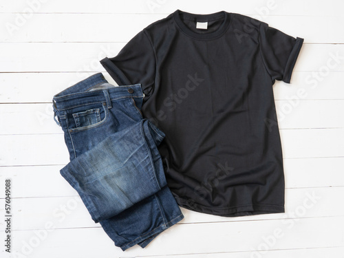 Black T Shirt mockup and Jeans on white wood background