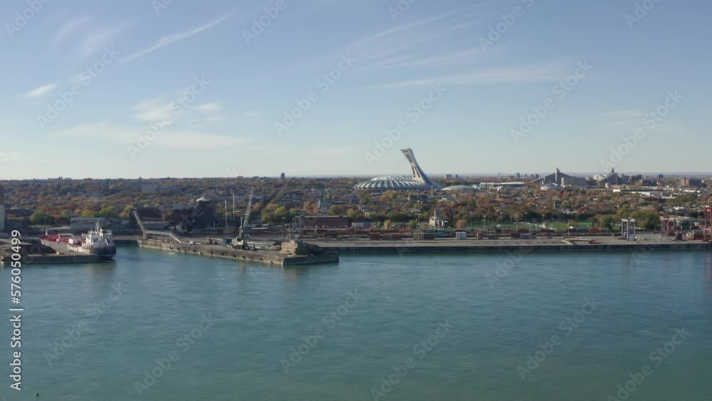 Drone view of St Lawrence river port of Montreal with Olympic stadium in the back Drone view of St Lawrence river port of Montreal with Olympic stadium in the back