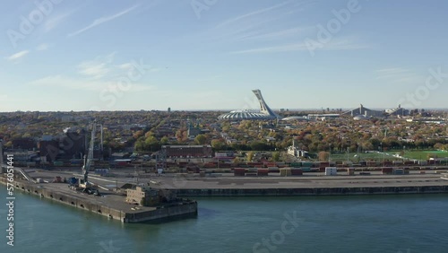 Drone view of Old port of Montreal with Olympic stadium in the back