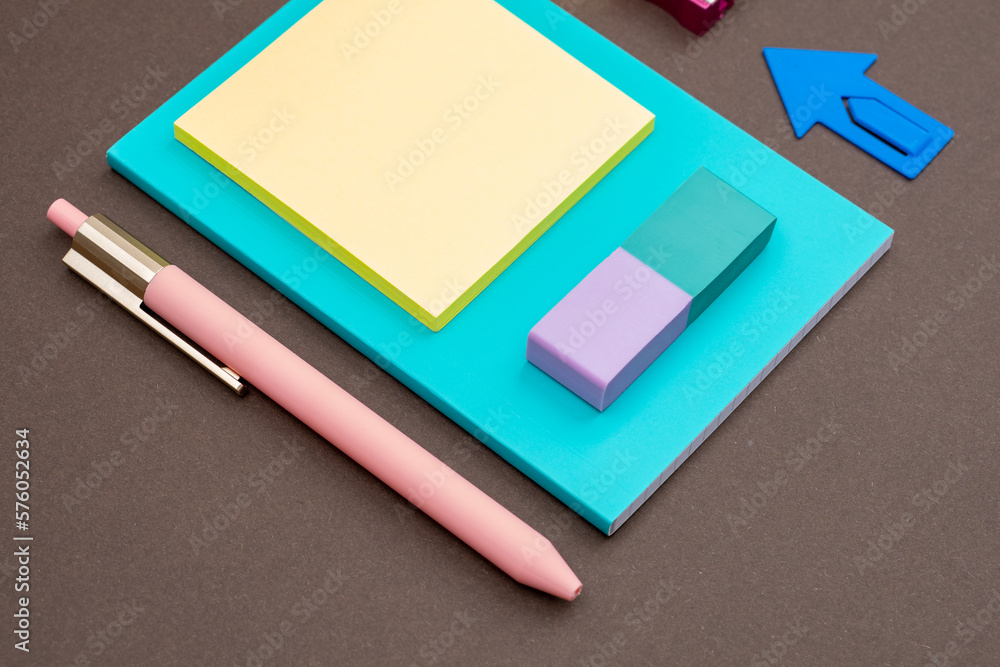 Stationery, pen, paper clip, note paper, stickers as office work concept Stationery, pen, paper clip, note paper, stickers as office work concept
