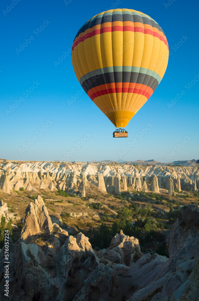 Cappadocia, Hot air balloon is flying over amazing landscape, Travel destination in Turkey