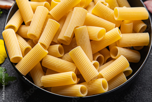 raw pasta rigatoni ingredients meal food snack on the table copy space food background rustic top view