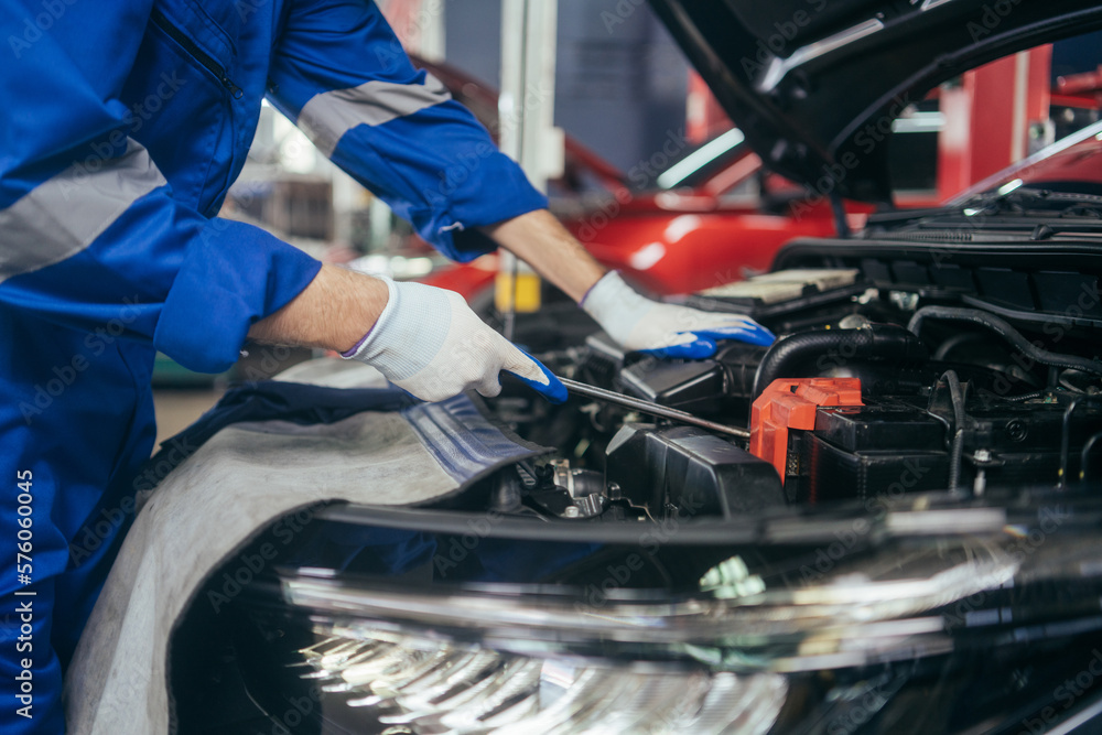 Automobile mechanic man checking car damage broken part condition, diagnostic and repairing vehicle at garage automotive, motor technician maintenance after service concept Automobile mechanic man checking car damage broken part condition, diagnostic and repairing vehicle at garage automotive, motor technician maintenance after service concept