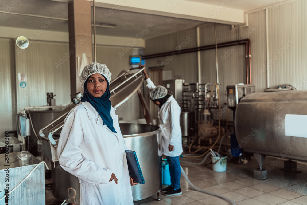 Arab business partner visiting a cheese factory. The concept of investing in small businesses Arab business partner visiting a cheese factory. The concept of investing in small businesses