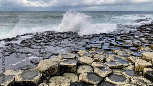 Giant's Causeway, area of interlocking basalt columns in Northern Ireland. Result of an ancient volcanic fissure eruption. The Causeway Coast natural wonder is managed by the National Trust.
