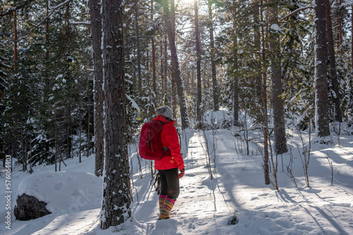 Woman hiking in snowy forest