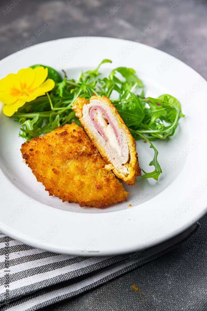 cordon bleu cutlet chicken meat, cheese, bacon second course meal snack on the table copy space food background rustic top view