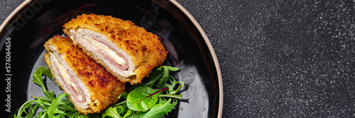cordon bleu cutlet chicken meat, cheese, bacon second course meal snack on the table copy space food background rustic top view