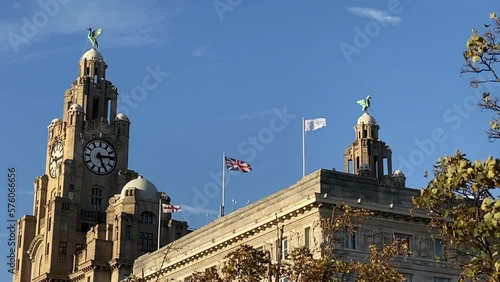 Liverpool, UK: The Royal Liver Building. Famous Pier Head building with clock and Liver Birds guarding city and the sea. Cunard Building, Two of the three graces. St George Cross and Union Jack photo