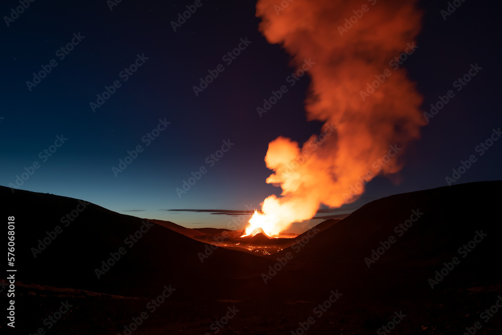 Volcano valley dawn eruption smoke Iceland