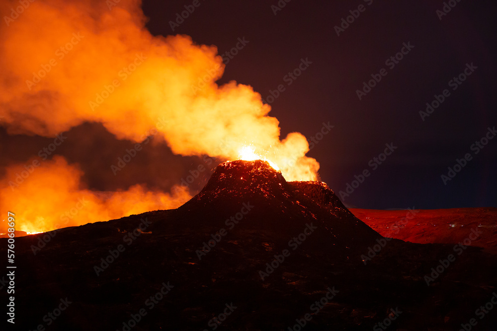 Night eruption close to volcano cone Iceland