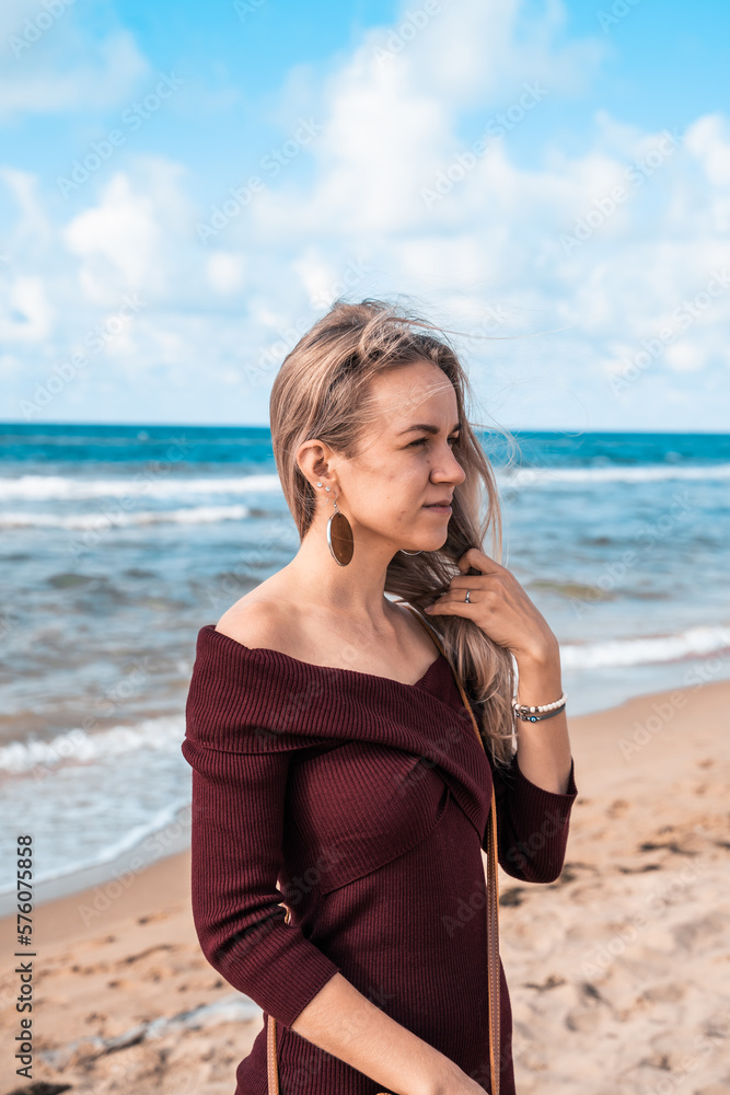 Woman on the sandy beach. Man on the sea or ocean. Atmospheric photo from a trip or vacation. Nice day. Walk along the coast. Loneliness and connection with nature. Habitat and lifestyle. Woman on the sandy beach. Man on the sea or ocean. Atmospheric photo from a trip or vacation. Nice day. Walk along the coast. Loneliness and connection with nature. Habitat and lifestyle.
