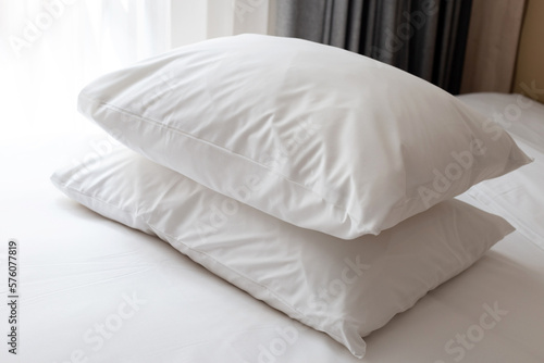 Bed with white pillows in bedroom