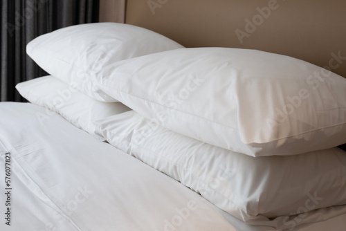 Bed with white pillows in bedroom