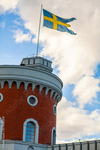 Swedish flag on top of Brick castle in Stockholm, Sweden photo