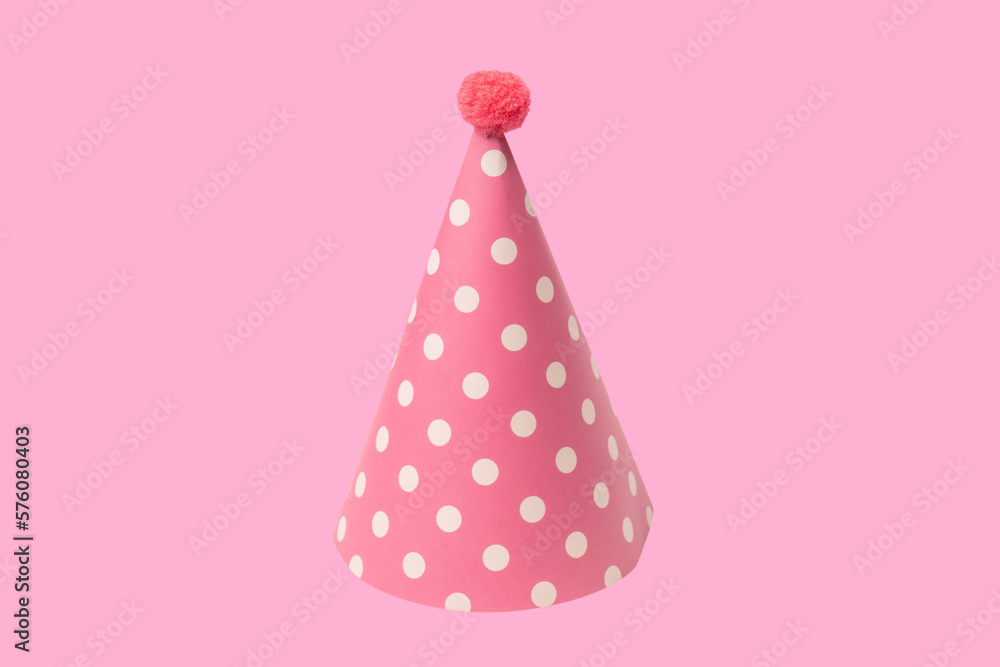 Bright and colorful birthday cap isolated on a pink background. Bright and colorful birthday cap isolated on a pink background.