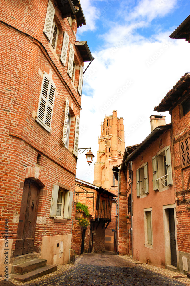 Albi, Roussillon-Languedoc, France. View of Cathedral Basilica of Saint Cecilia (UNESCO World Heritage Site) through a narrow medieval street 