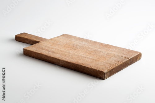 Rustic rectangular wooden cutting board isolated on white background