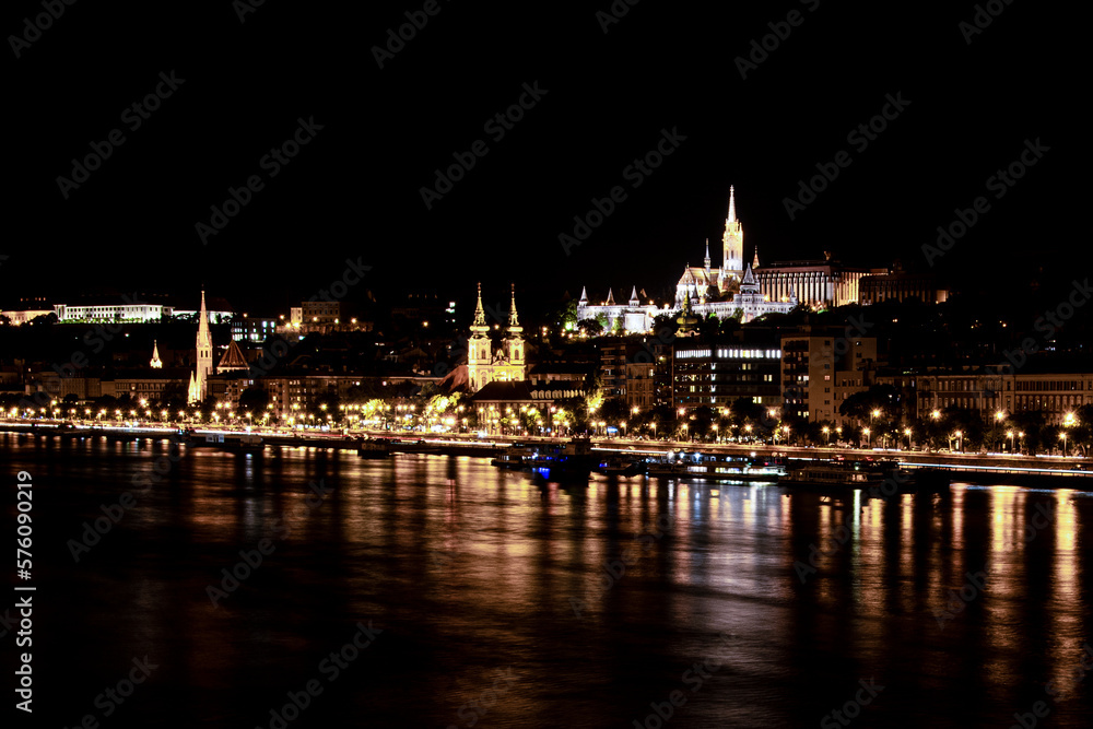 Matthias Church, Fisherman's Bastion and the night lights of the Danube bank, Budapest, Hungary