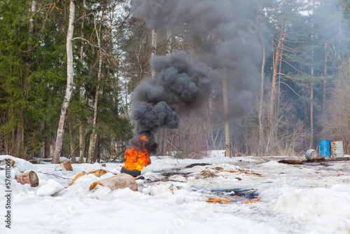 russian military tank with soldiers in ukraine in winter goes on the attack under fire