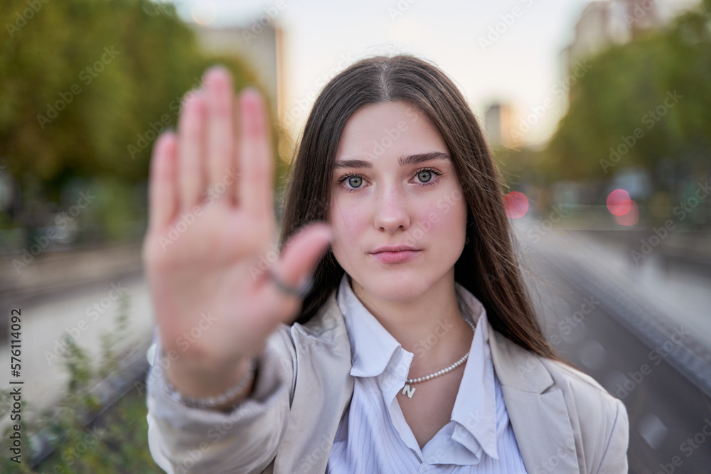 Young caucasian woman wearing business style doing stop sing with palm of the hand. warning expression with negative and serious gesture on the face.