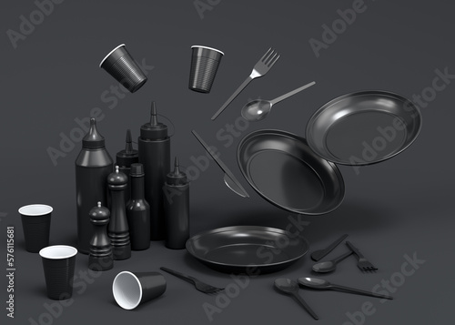 Set of disposable utensils like plate, folk, spoon and knife on monochrome black