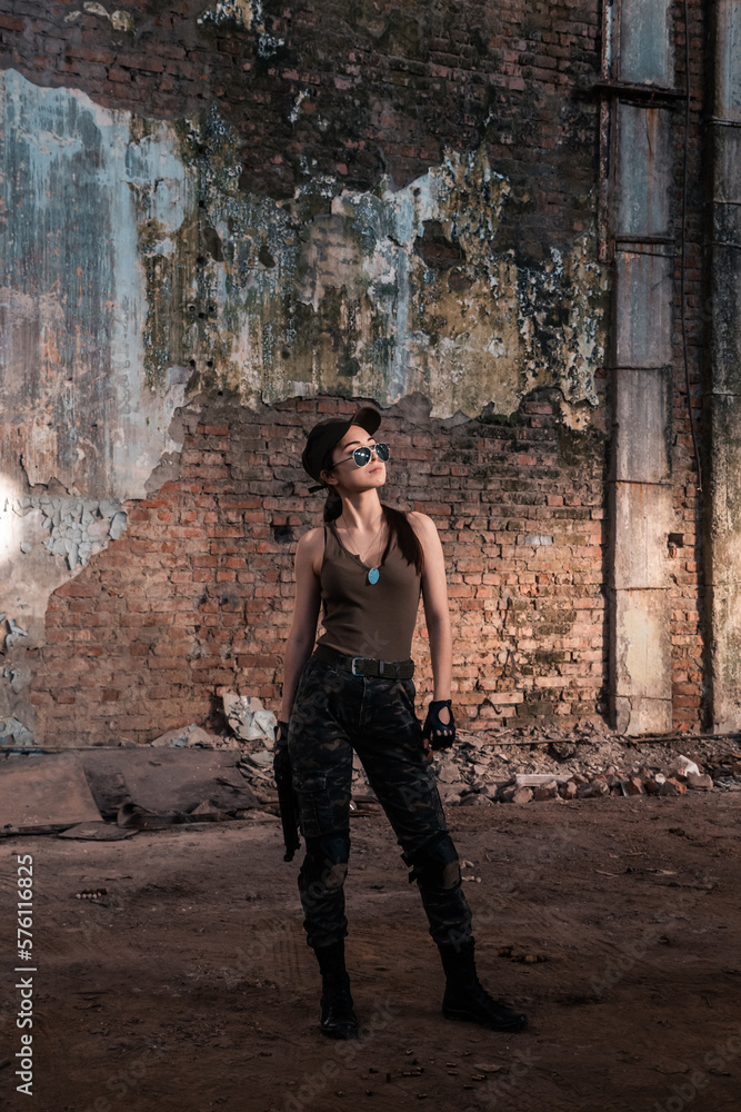 Female soldier with weapons. Character from the comic book The Punisher. Armed with a pistol and machine gun. A dangerous person who solves problems with force. Female soldier with weapons. Character from the comic book The Punisher. Armed with a pistol and machine gun. A dangerous person who solves problems with force.