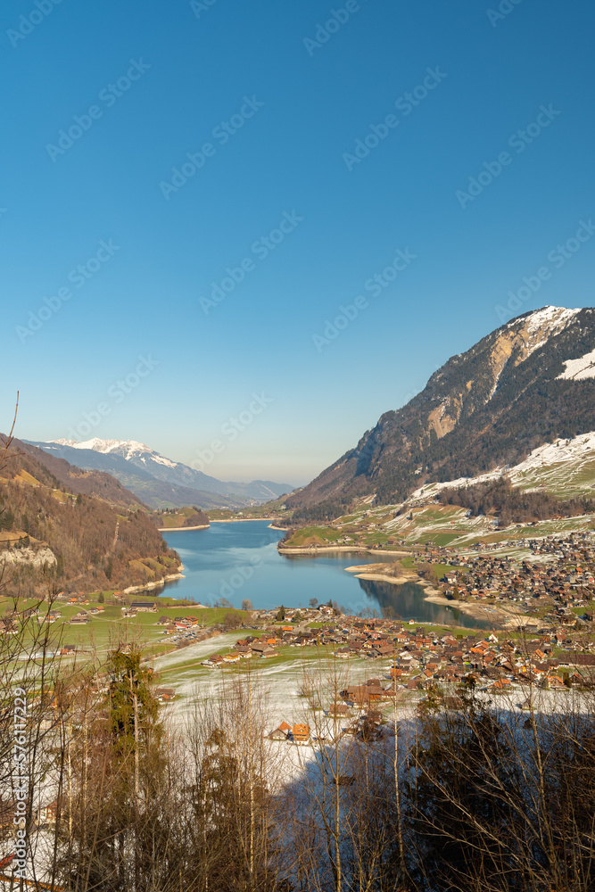 Lake of Lungerersee surrounded with a fantastic mountain panorama in Lungern in Switzerland