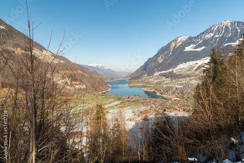 Lake of Lungerersee surrounded with a fantastic mountain panorama in Lungern in Switzerland photo