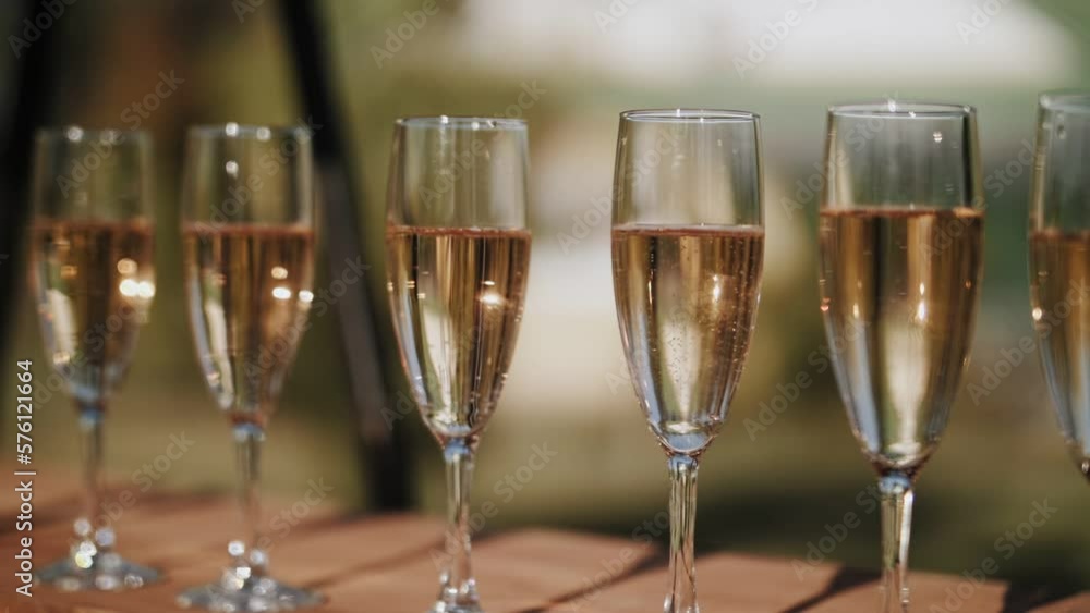 Glasses of champagne at the festival. Bubbles in sparkling wine. Glasses of champagne at the festival. Bubbles in sparkling wine.