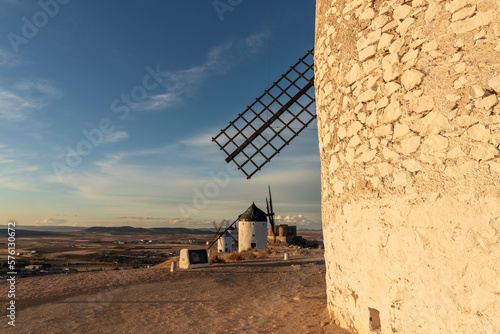 Group of old windmills in the city of Consuegra Spain   on the route of the Don Quixote and Cervantes mills  at sunset