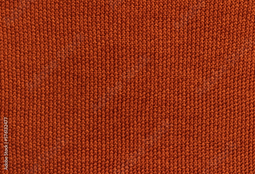 Knitted orange background. Thread texture.