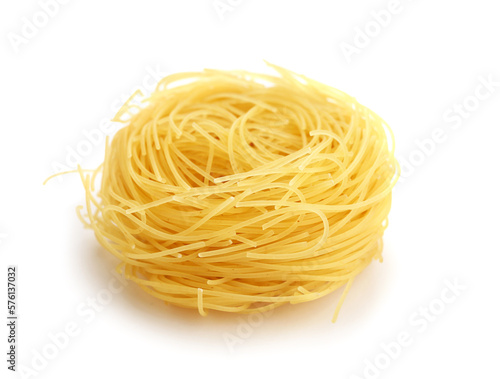 Canvas Print Raw pasta nest on white background