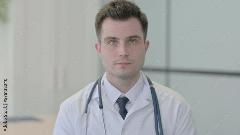 Portrait of Serious Male Young Doctor in Clinic Portrait of Serious Male Young Doctor in Clinic
