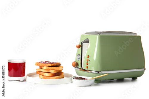Modern toaster, glass of juice and tasty toasts with jam isolated on white background